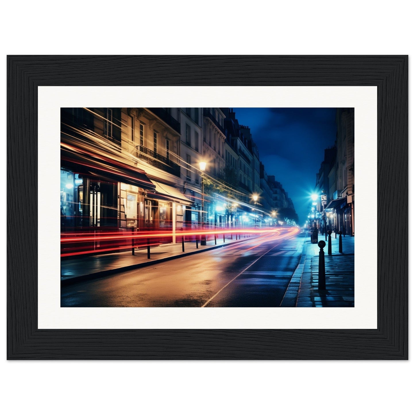 Framed photograph of a city street at night with light trails from passing vehicles.