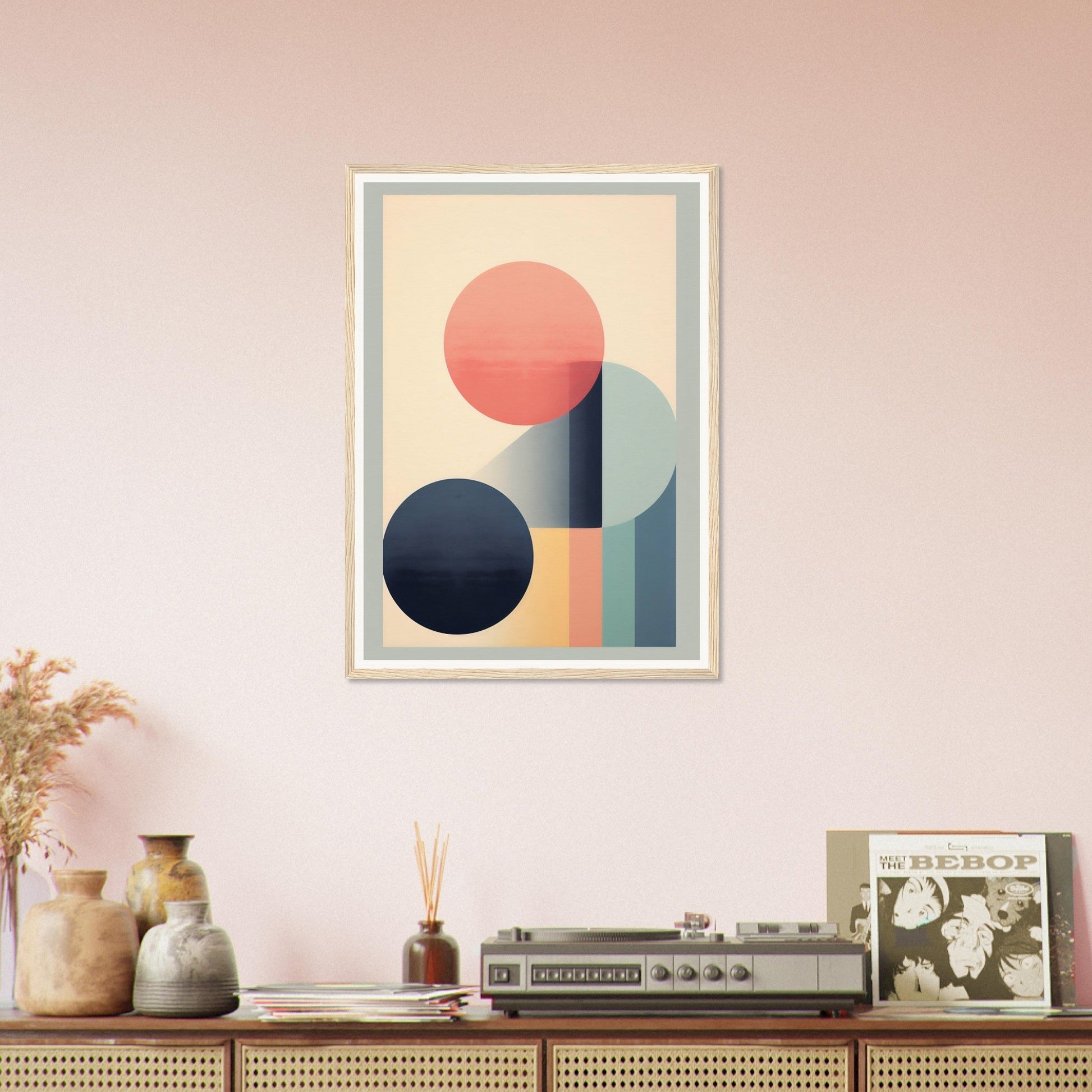 Framed abstract geometric artwork featuring circles and rectangular shapes in pastel colors.