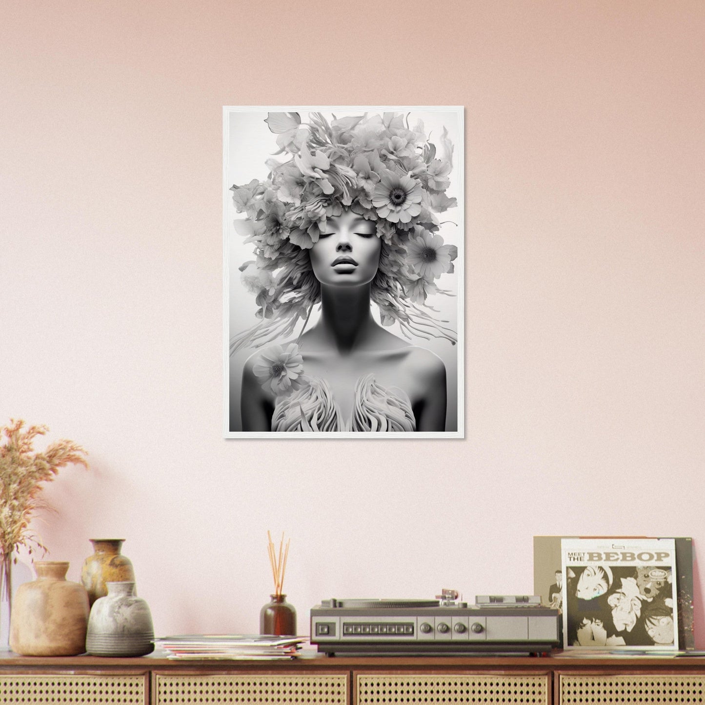 Black and white photograph of a person adorned with an elaborate floral headdress.