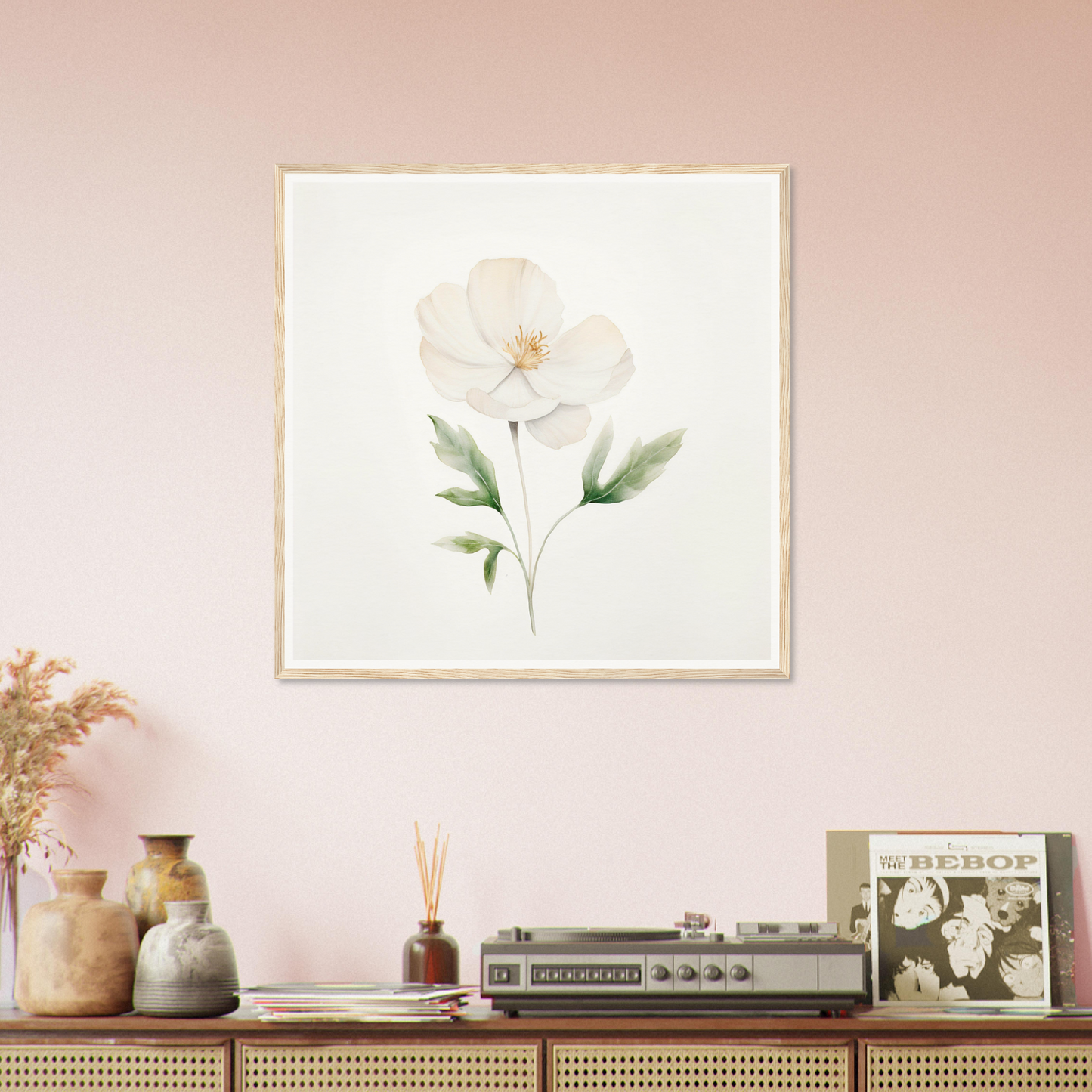 Framed watercolor painting of a single white flower with green leaves.