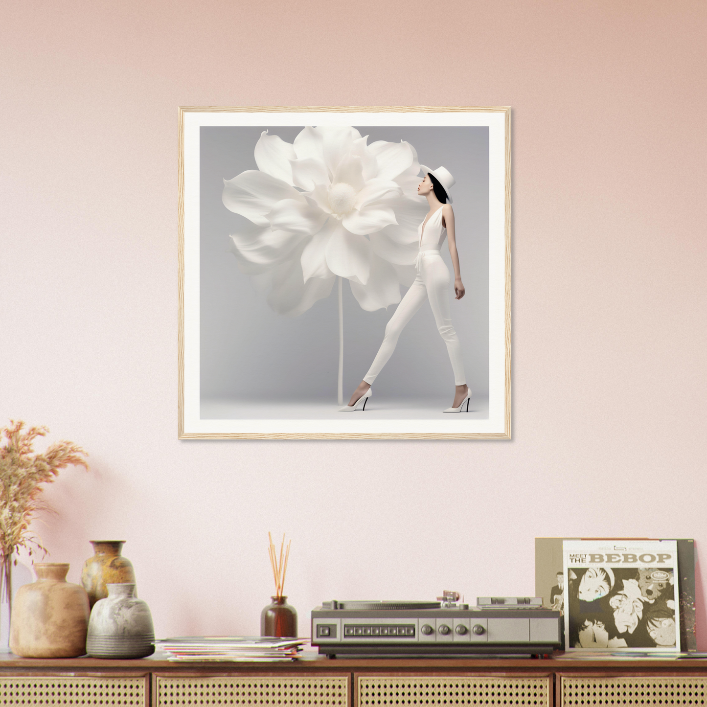 Framed artwork depicting a woman in white seemingly merged with a large flower.