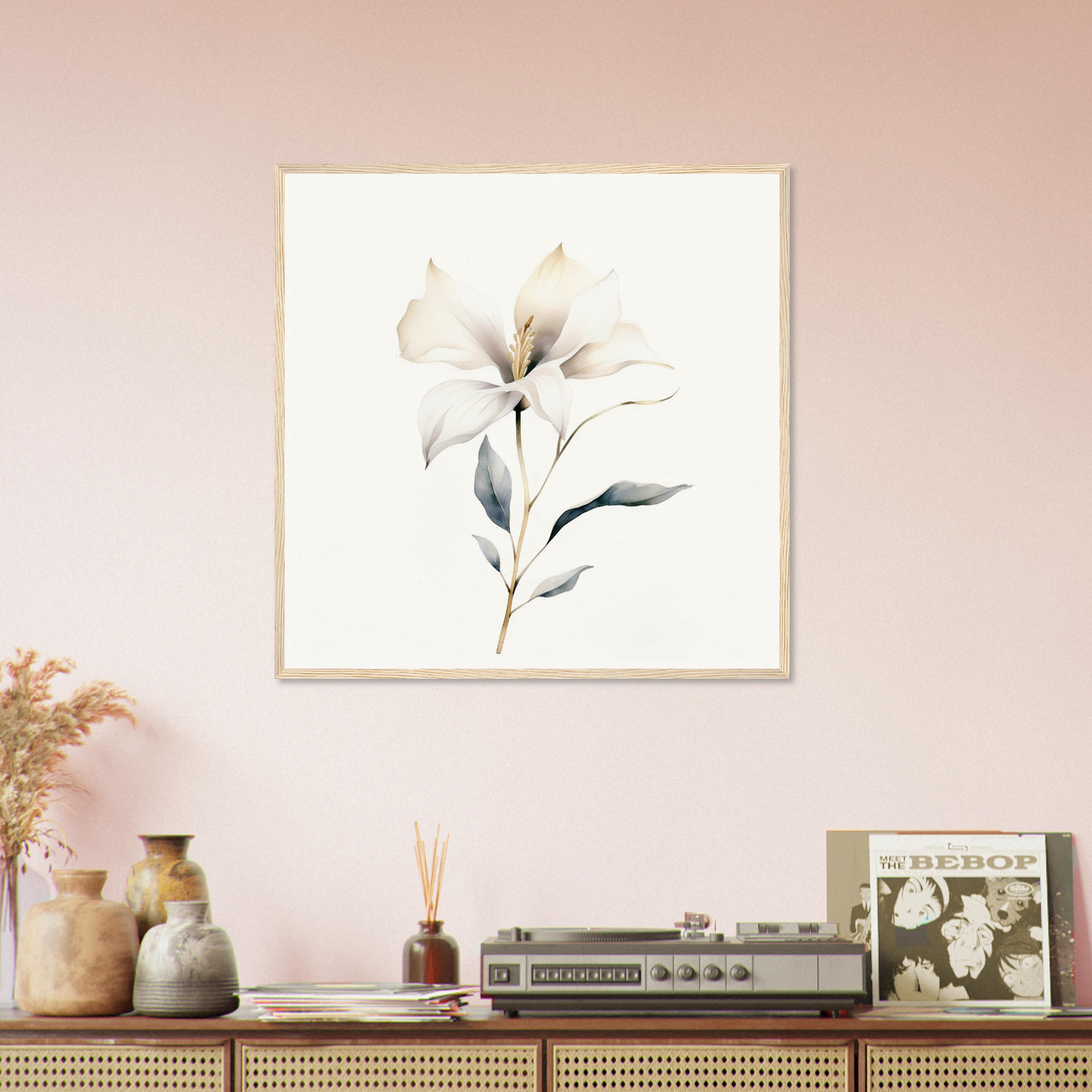 Framed watercolor painting of a delicate white flower with leaves.