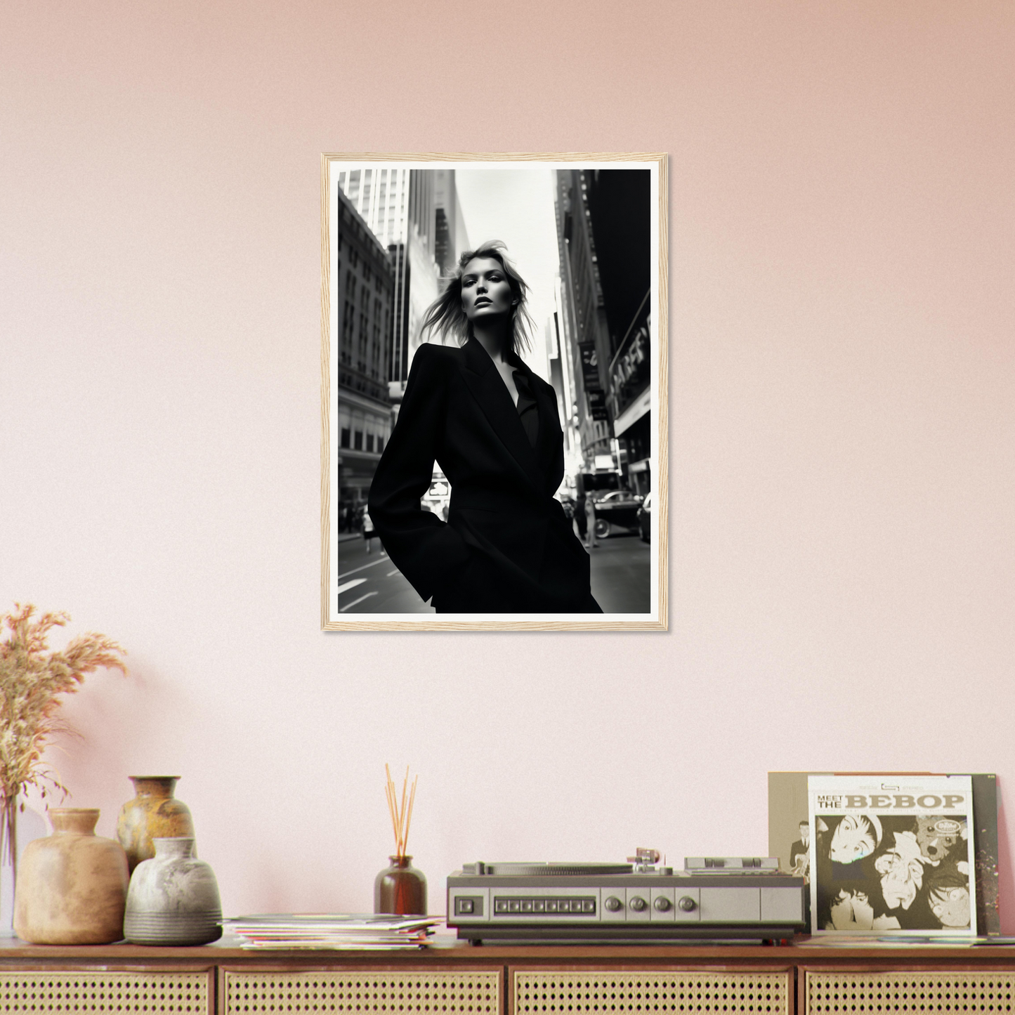 Black and white photograph of a woman in a dark coat on a city street.