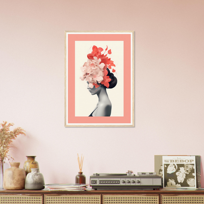 Framed artwork featuring a silhouette with floral hair against a pink background.