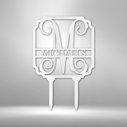 Decorative monogram cake topper with the name ’MICHAELS’ and ornate scrollwork design.