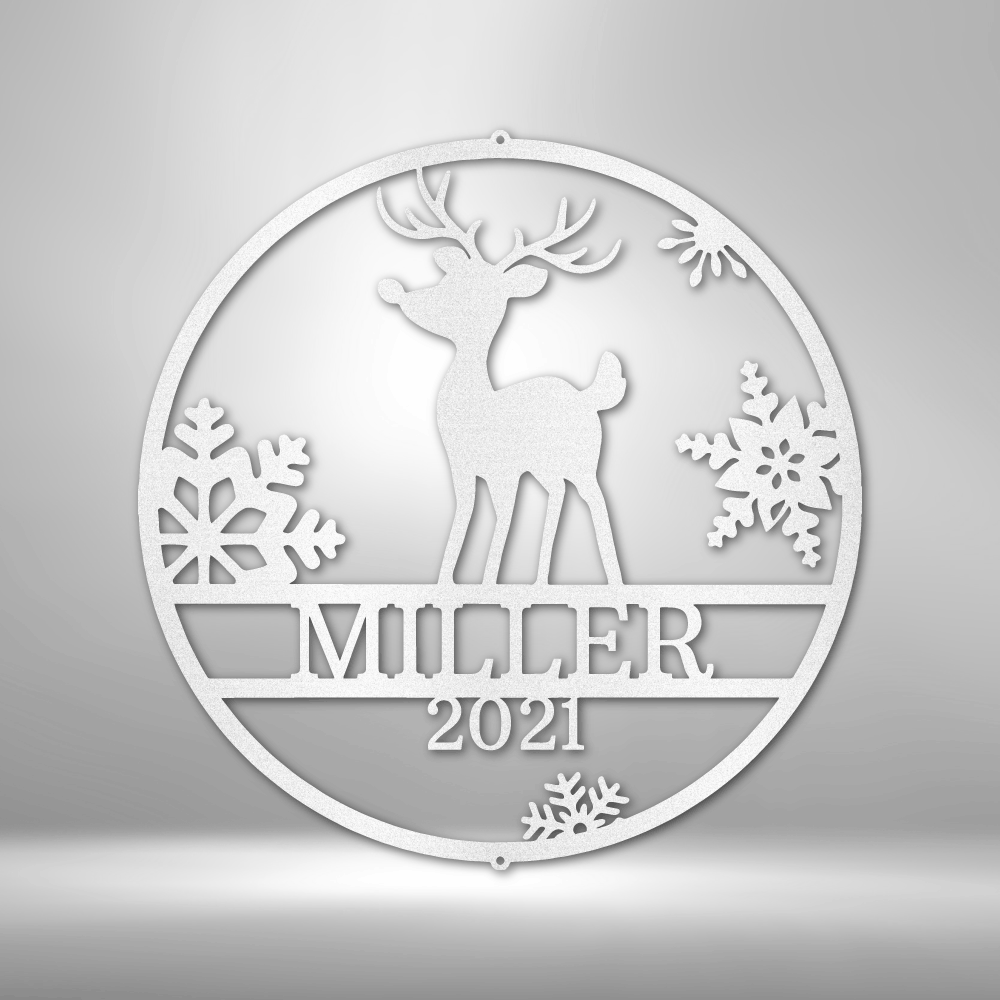 Circular white ornament featuring a reindeer silhouette, snowflakes, and ’WINTER 2021’’ text.