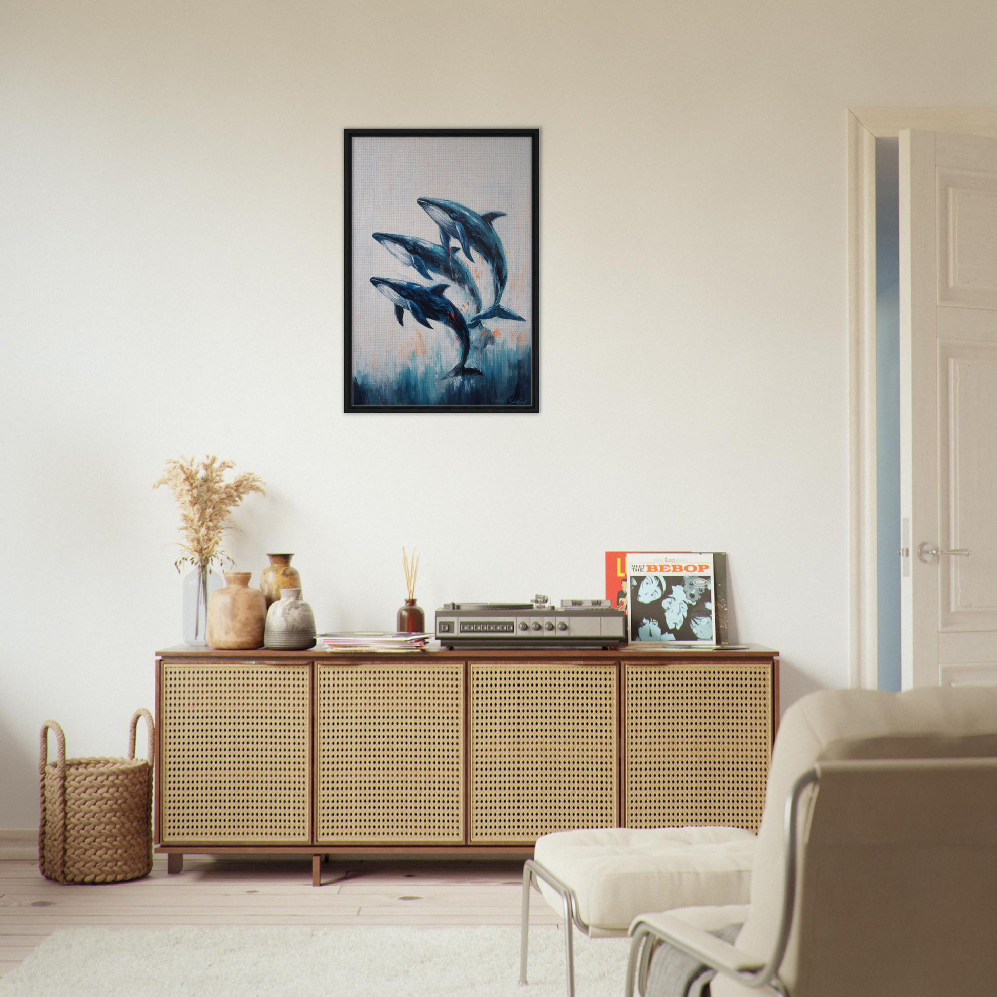 Wooden sideboard with rattan doors below framed canvas print in Oceanic Graceward Reverie