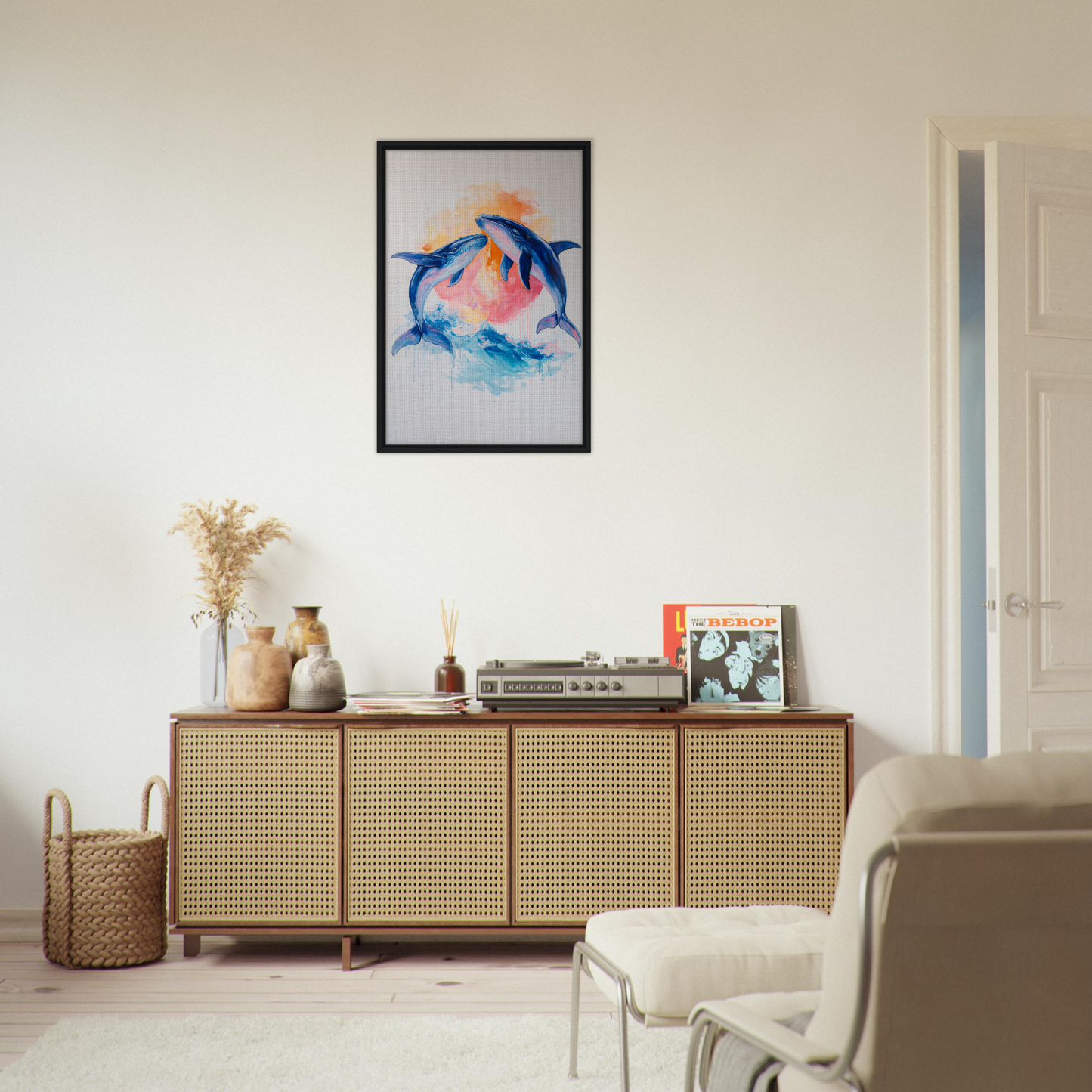 Framed canvas print of colorful dolphins in Oceanic Whirl Sanctuary above a wooden sideboard