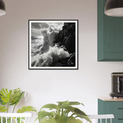 Black and white framed photo of ocean’s unyielding fury crashing against rocky cliffs