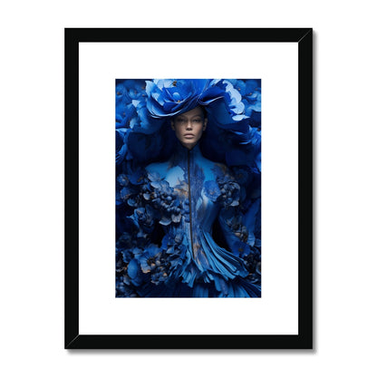 Framed artwork depicting a figure adorned in vibrant blue floral and feathered elements.