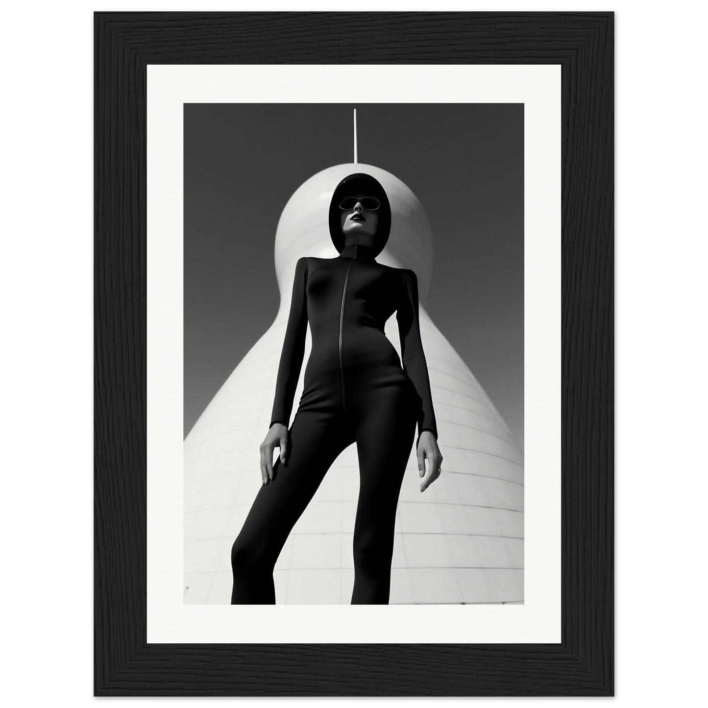 Silhouetted figure in a form-fitting bodysuit standing beneath a curved white shape.