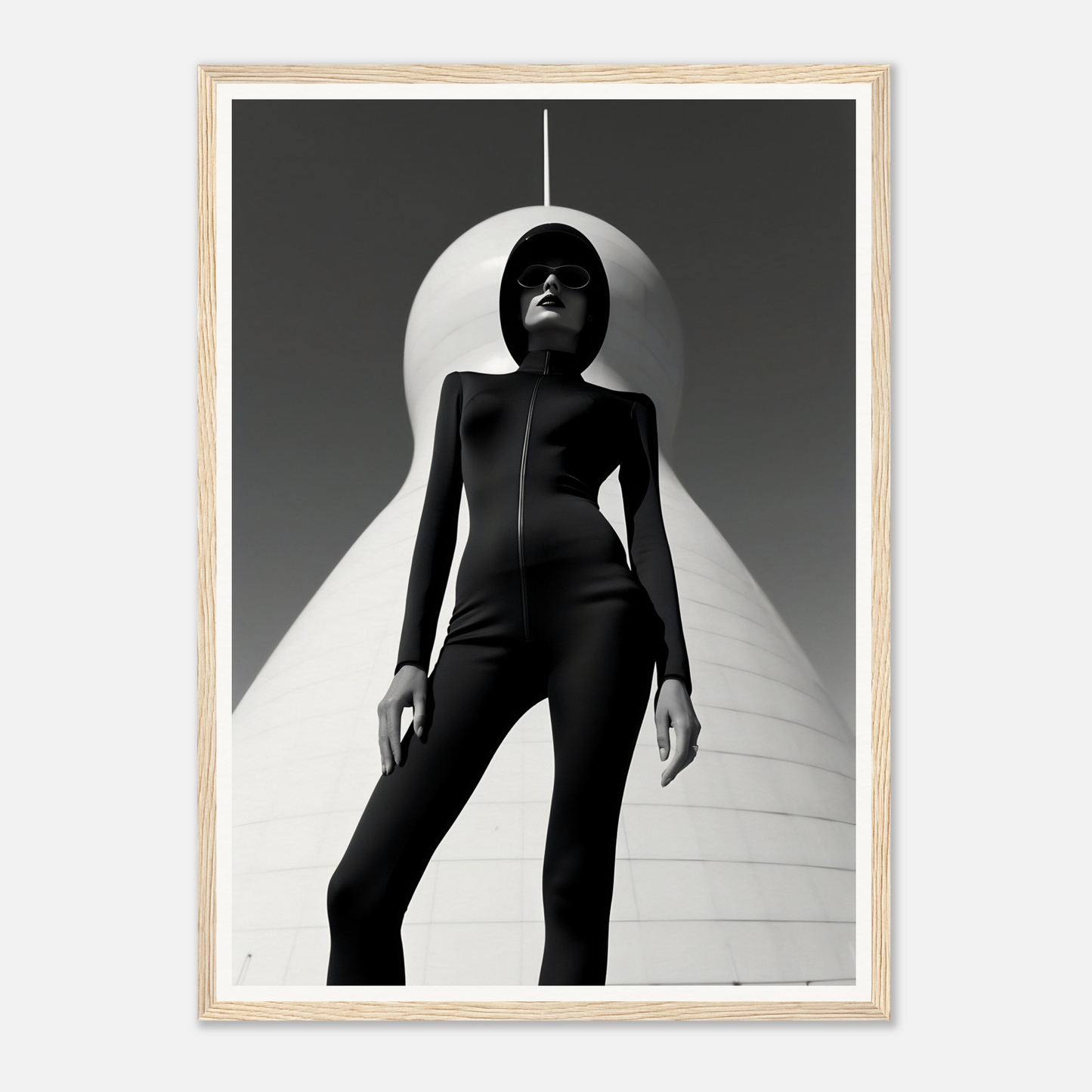 Silhouetted figure in a sleek black bodysuit standing dramatically under a spotlight.