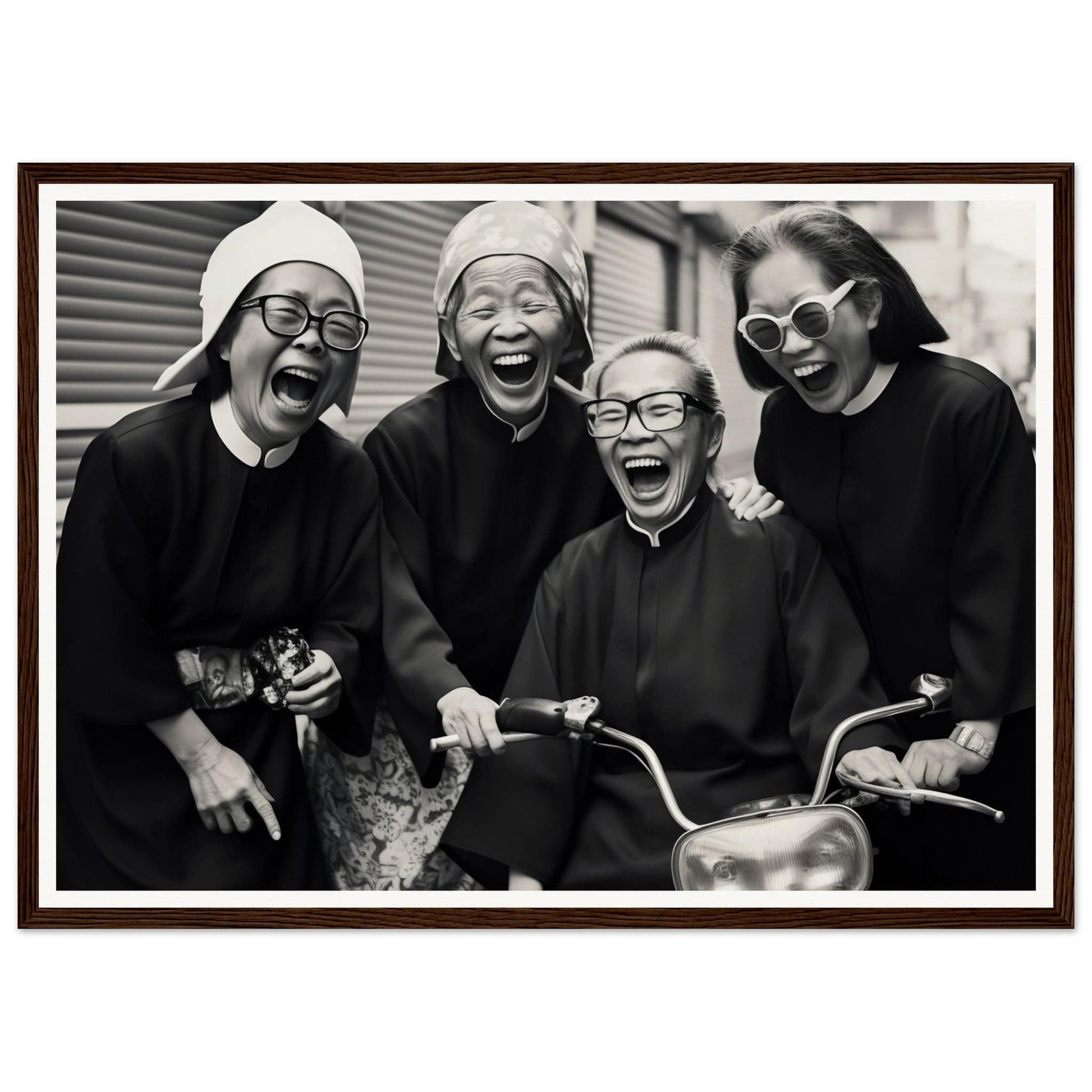 Black and white photograph of four joyful women, three in religious habits and one in sunglasses, gathered around a motorcycle.
