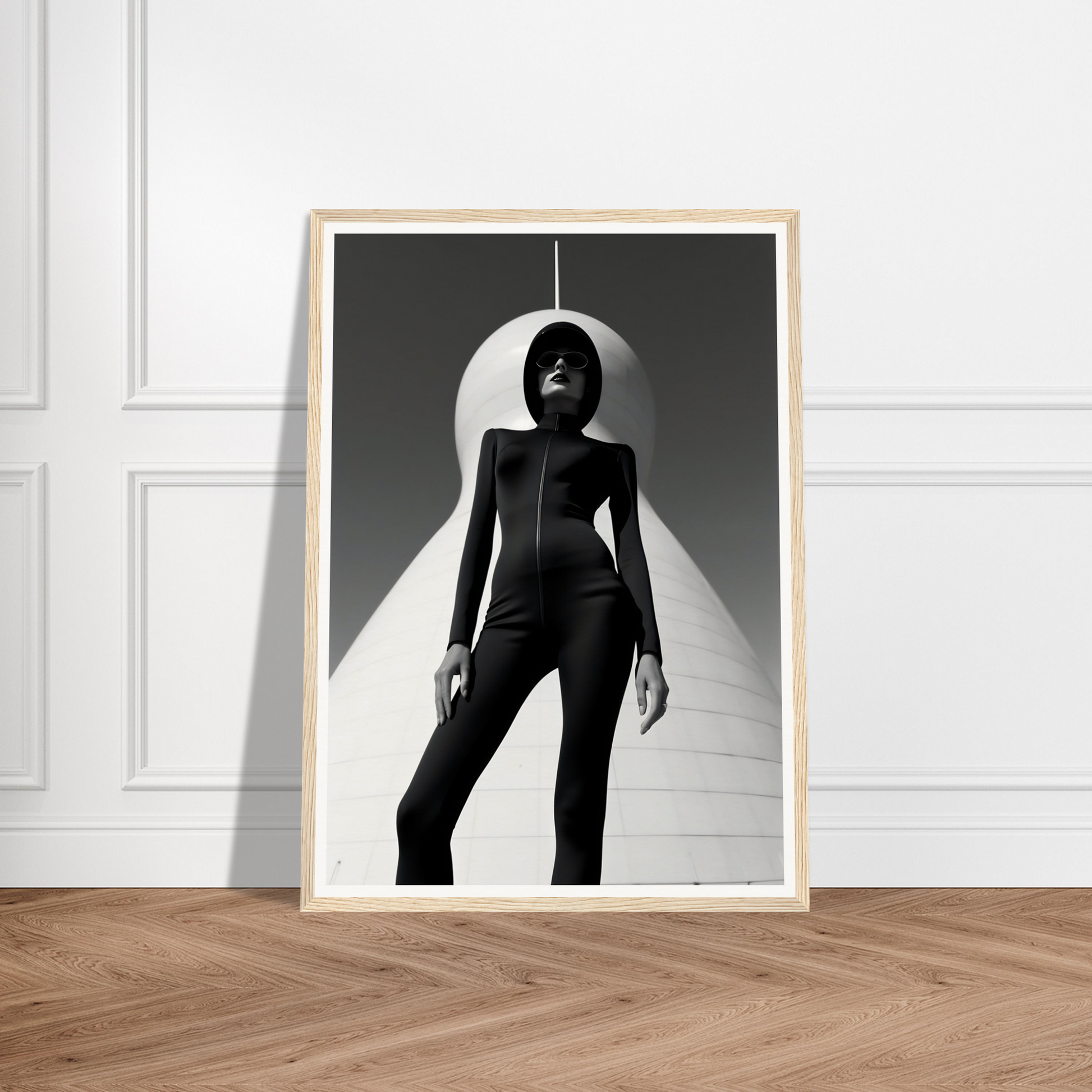 Black and white photograph of a silhouetted figure in a dramatic pose framed against a circular light.