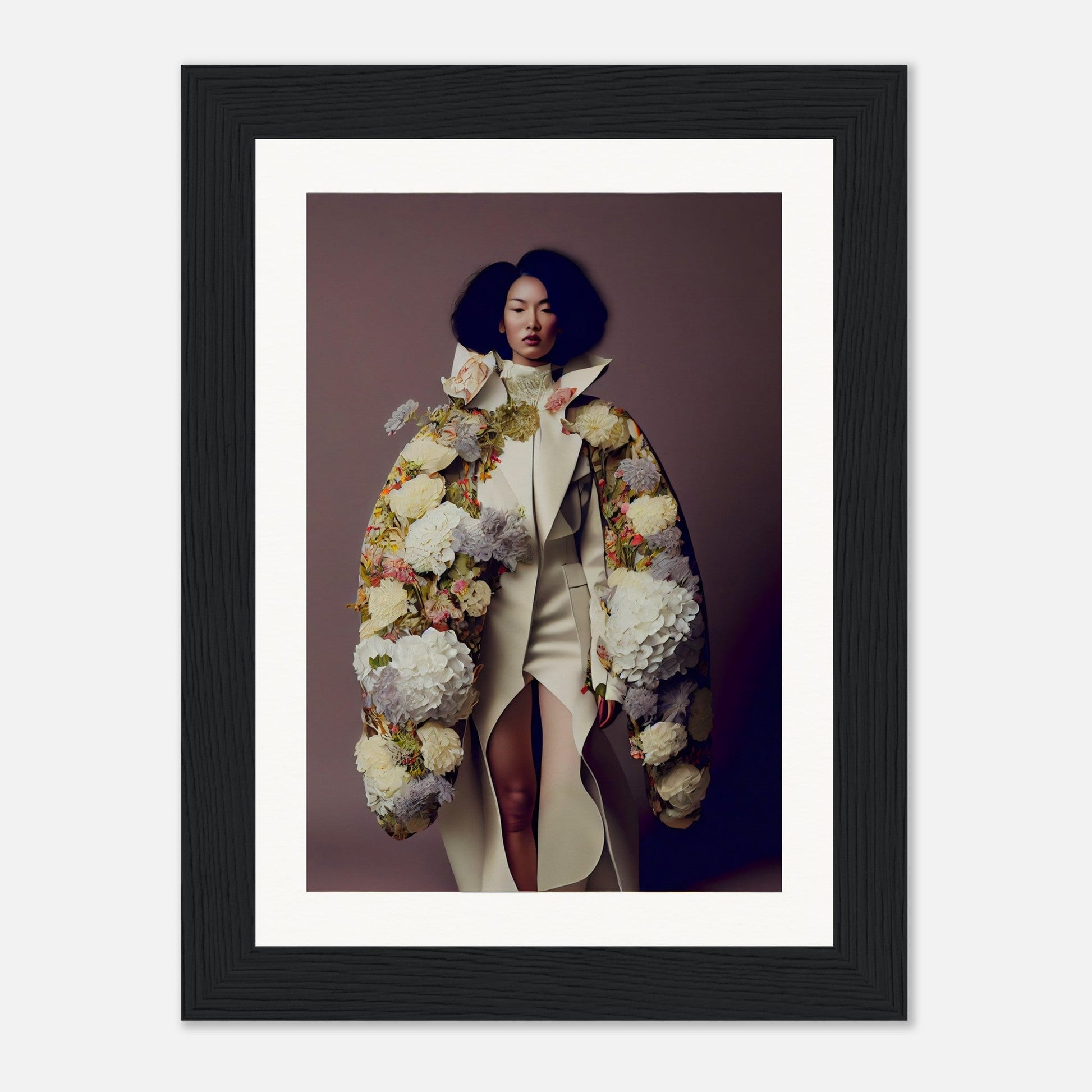 Framed photograph of a woman wearing an extravagant floral coat over a white outfit.