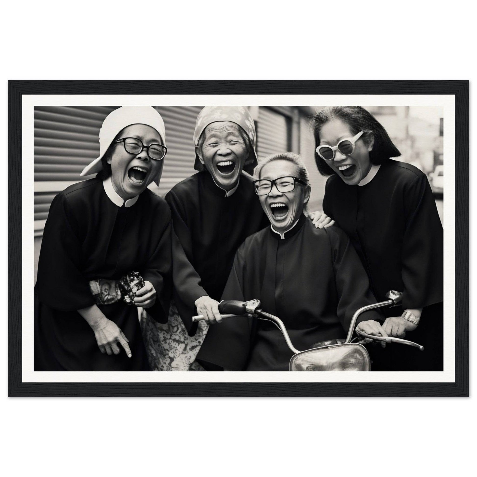Black and white photograph of four laughing women, three wearing white hats and one wearing sunglasses.