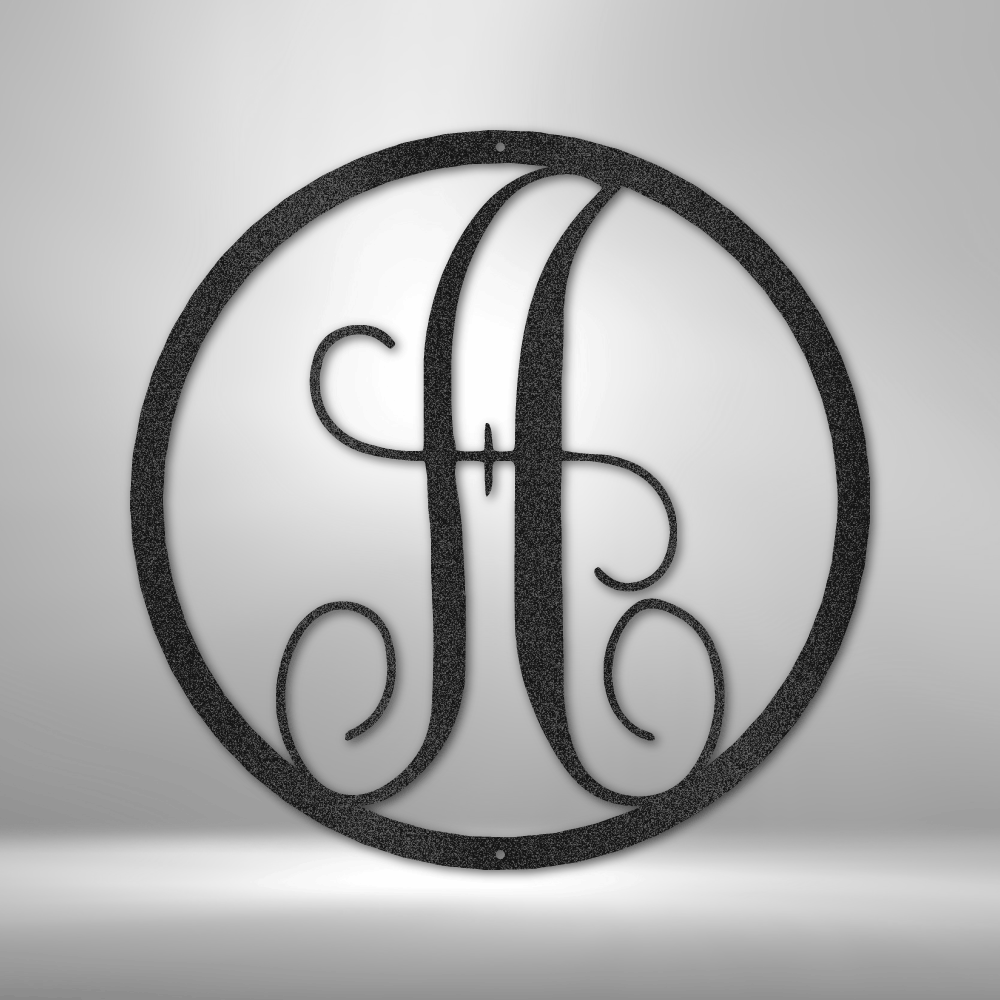 Ornate letter ’A’ enclosed within a circular frame.