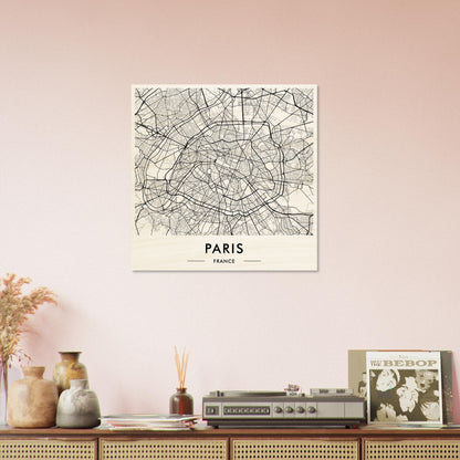 Map of Paris displayed as wall art above a shelf with decorative objects.