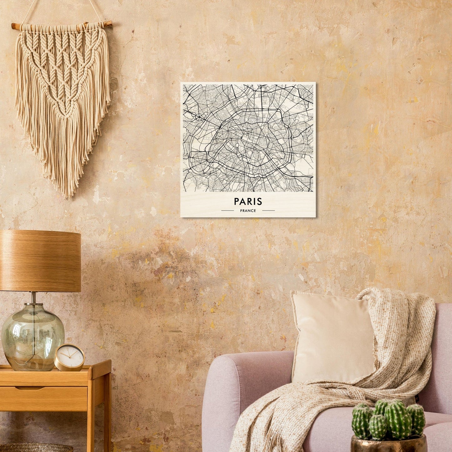 Map of Paris displayed as wall art alongside bohemian-style decor elements.