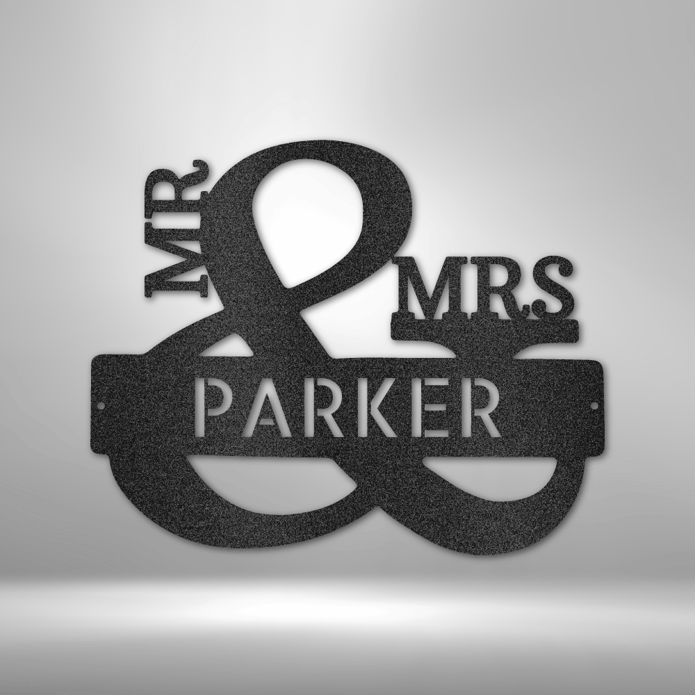 Metal wall sign displaying ’MR & MRS PARKER’ with an ampersand as the focal point.