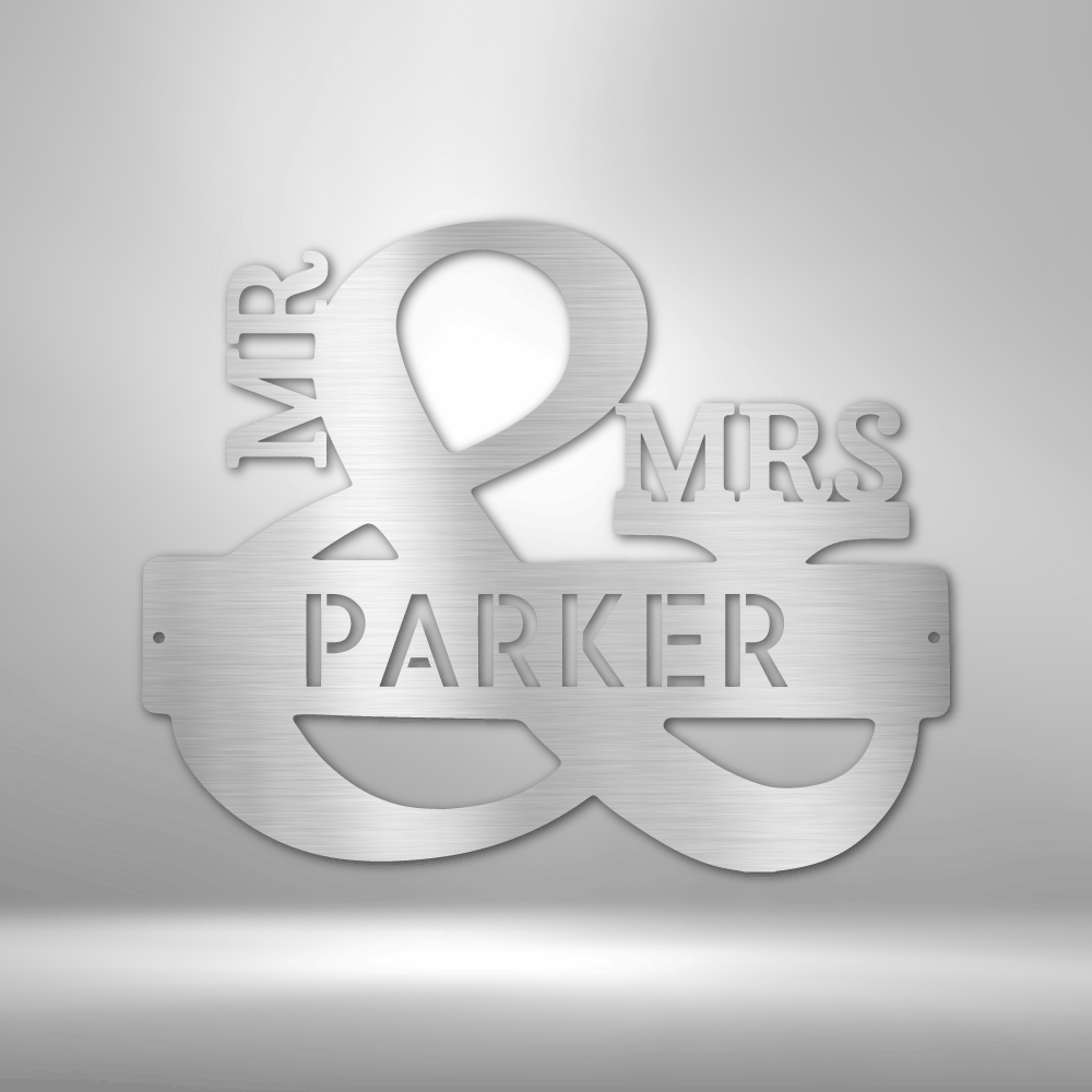 Metal ampersand sign with ’MR’ and ’MRS PARKER’ text incorporated into its design.