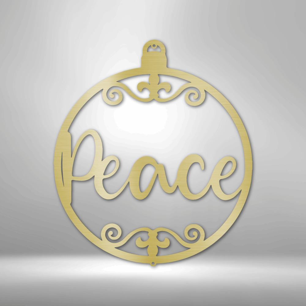 Gold ornamental decoration featuring the word ’Peace’ in cursive script within a circular frame adorned with decorative swirls.