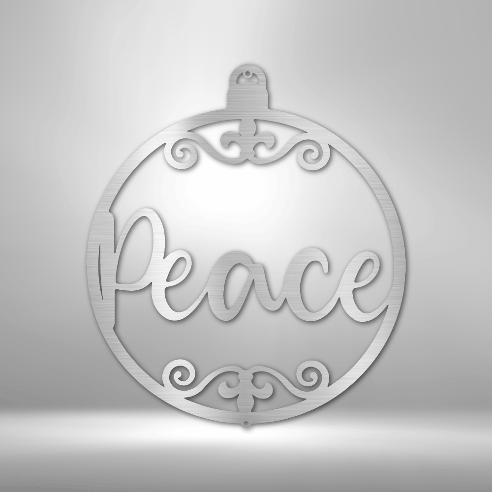 Ornamental circular pendant with the word ’Peace’ inscribed and decorative swirls.