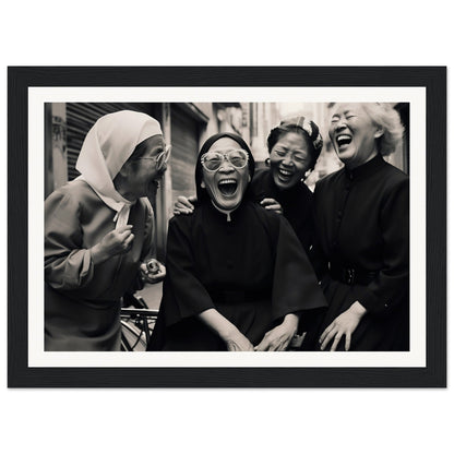 Black and white photograph of four women laughing together.