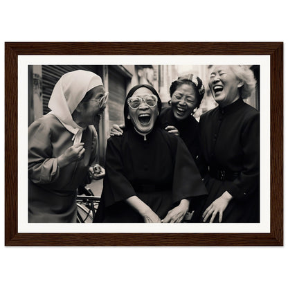 Black and white photograph of four women laughing joyfully together.