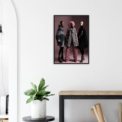 Framed photograph of three models wearing avant-garde fashion outfits.