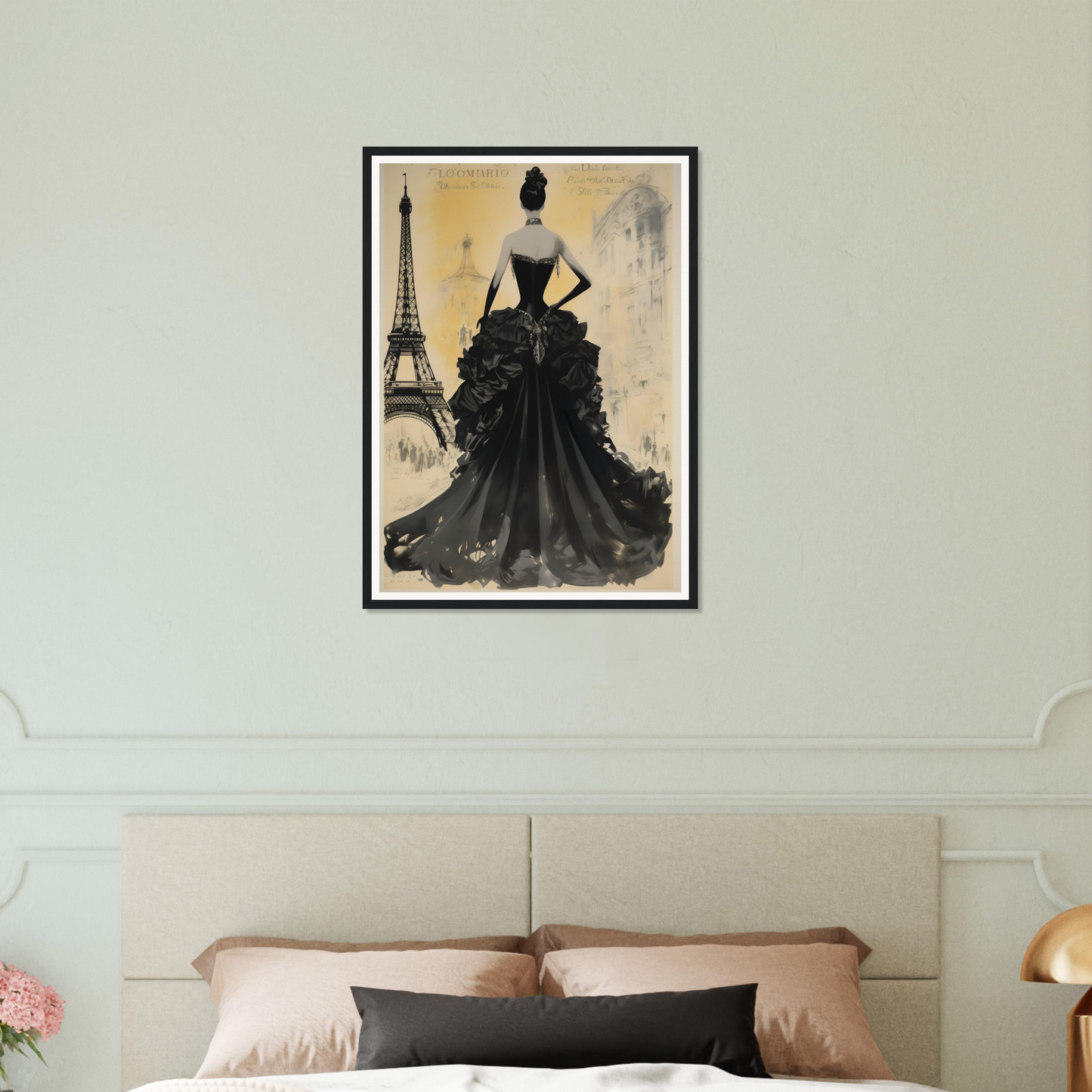 There is a picture of a woman in a dress on a bed