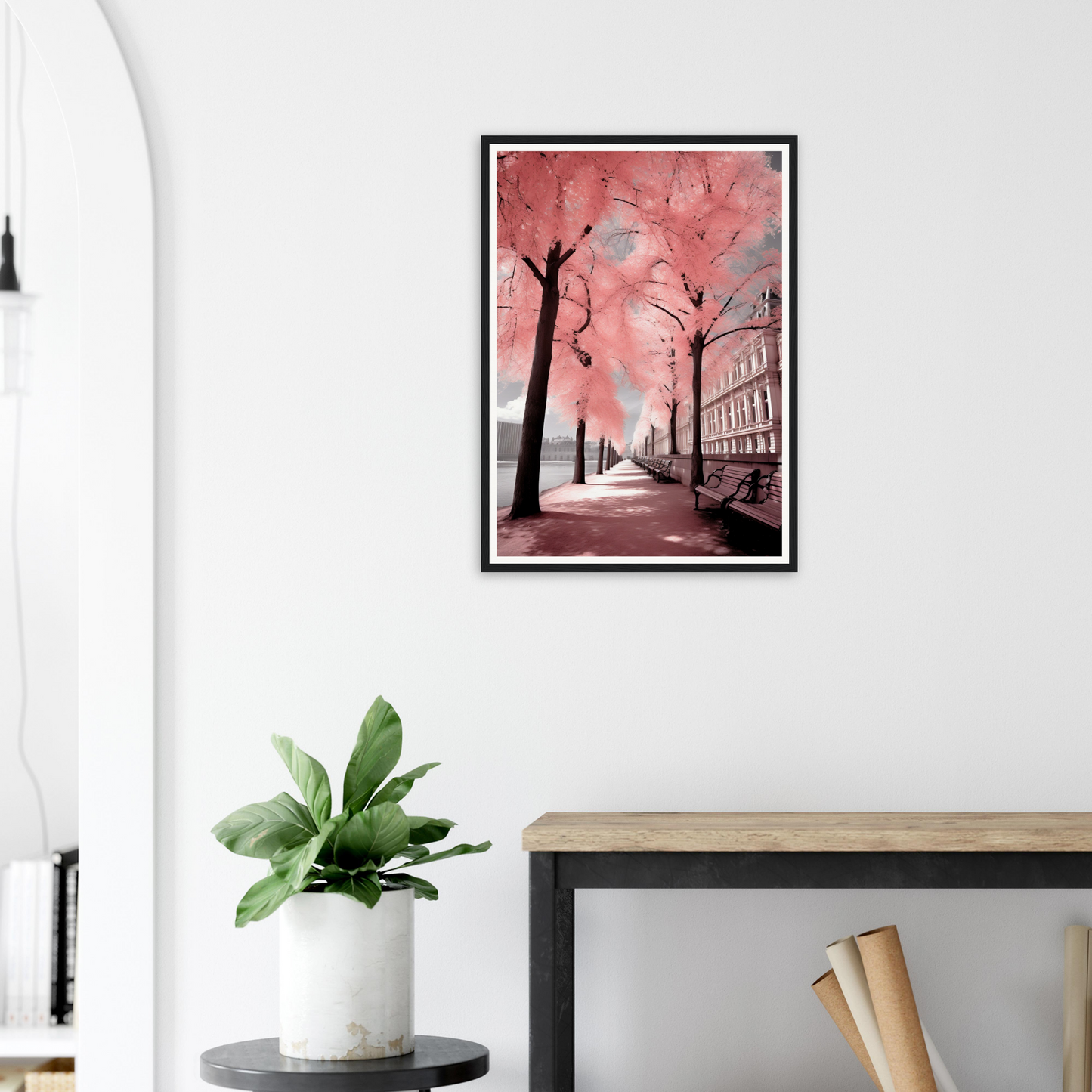 A pink and black painting on a wall