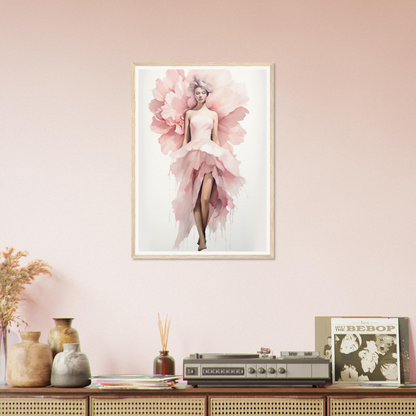 A pink flower in a frame on a wall