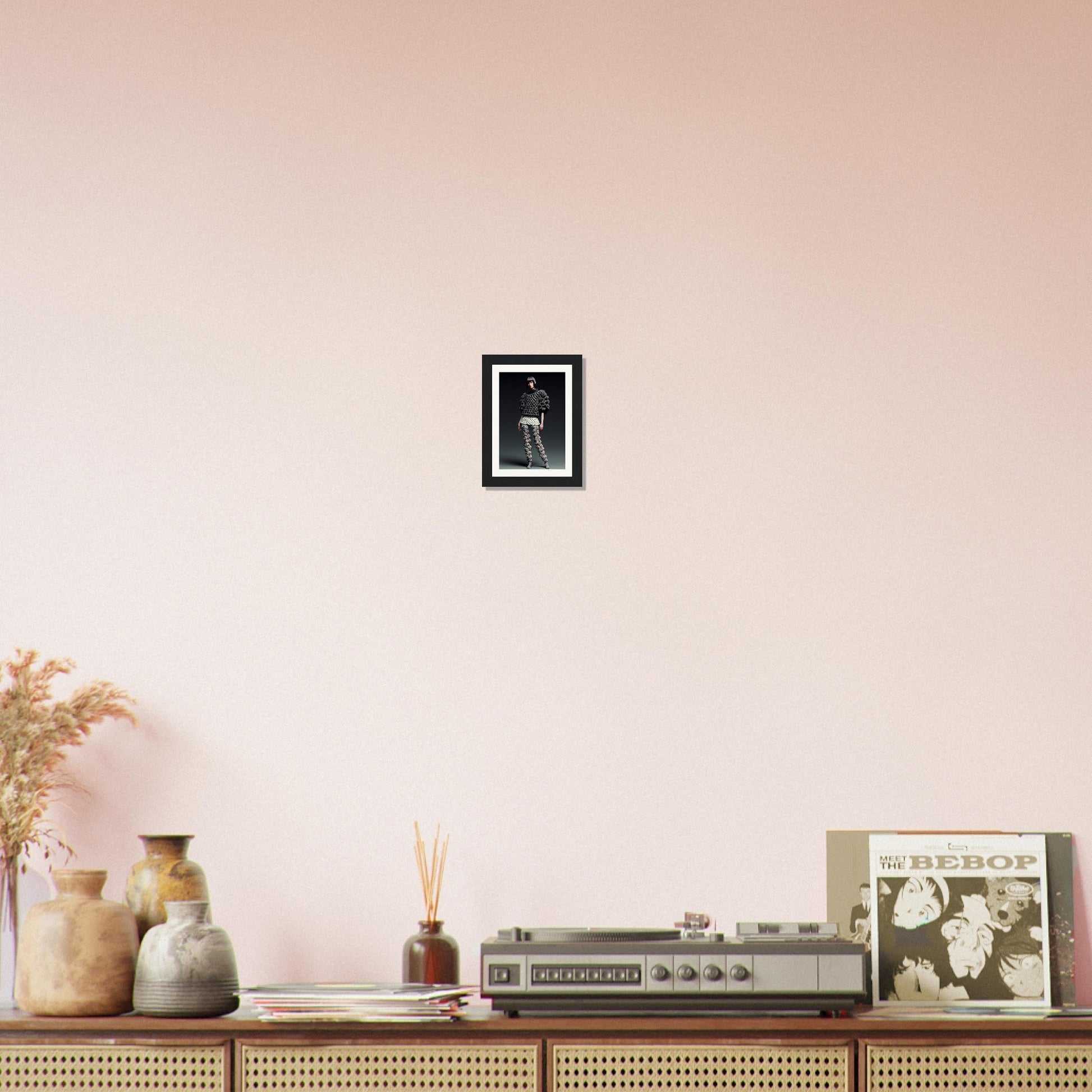 A pink wall with a black frame