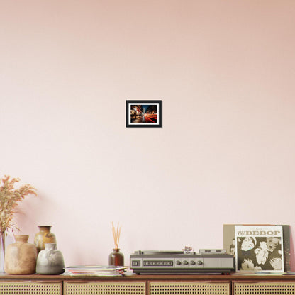 A pink wall with a picture of a woman