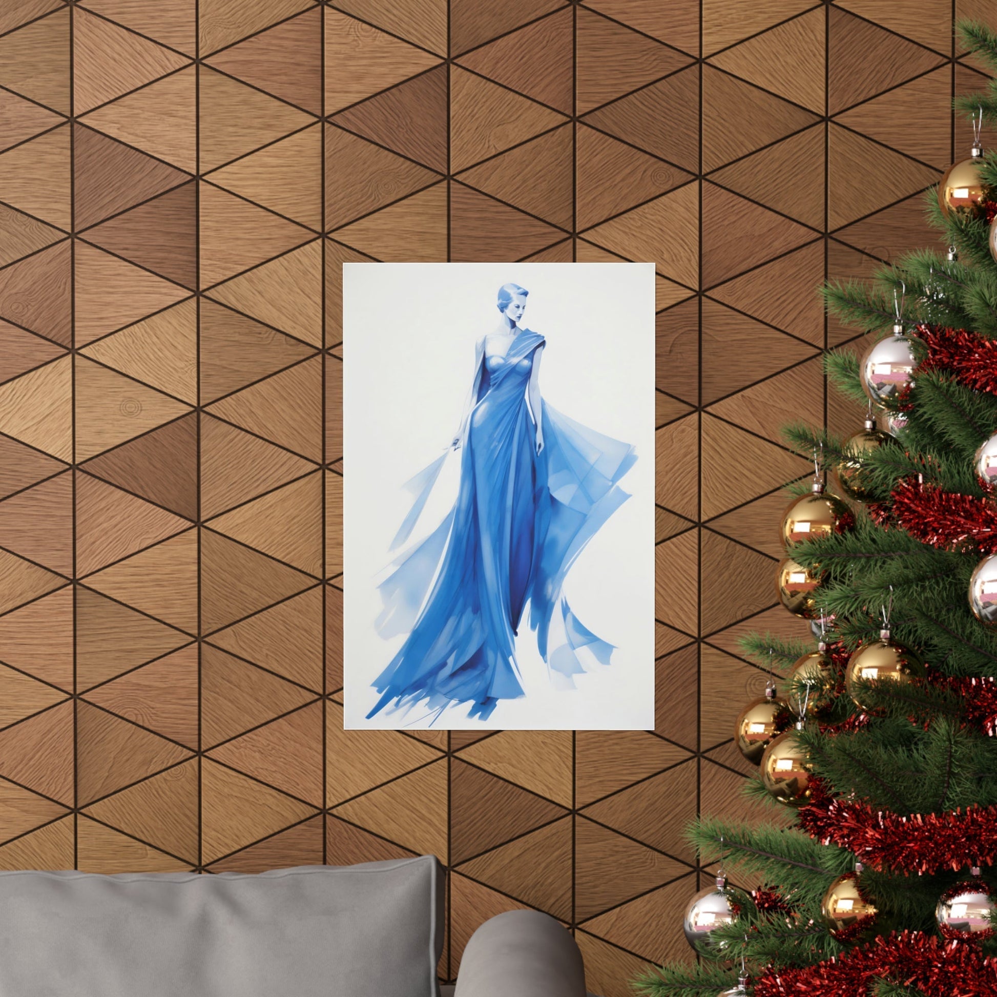 A christmas tree with a blue dress hanging on it