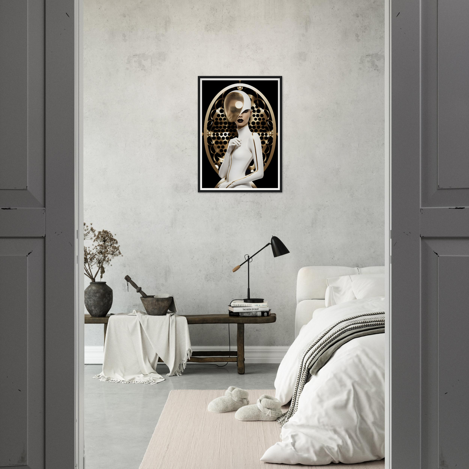 Monochrome bedroom with a framed portrait on the wall.