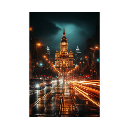 Illuminated ornate cathedral or church building with a tall central spire at night.