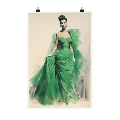 Elegant woman in a flowing green evening gown with dramatic tulle detailing.