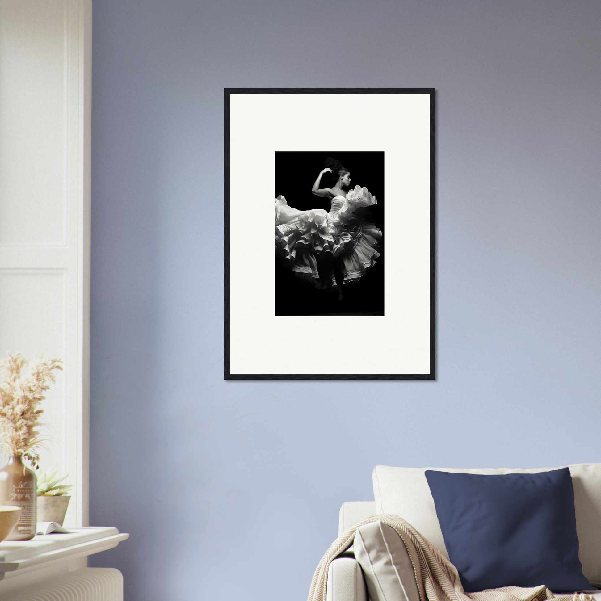 Framed black and white photograph of a dancer in a flowing dress.