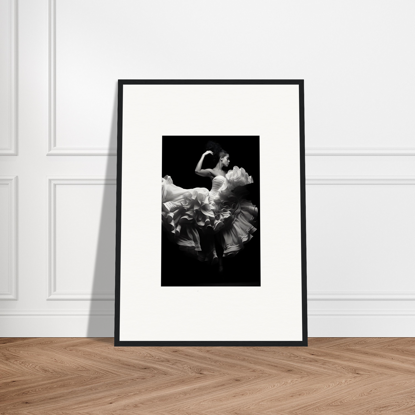 Framed black and white photograph of a dancer in a flowing dress mid-twirl.