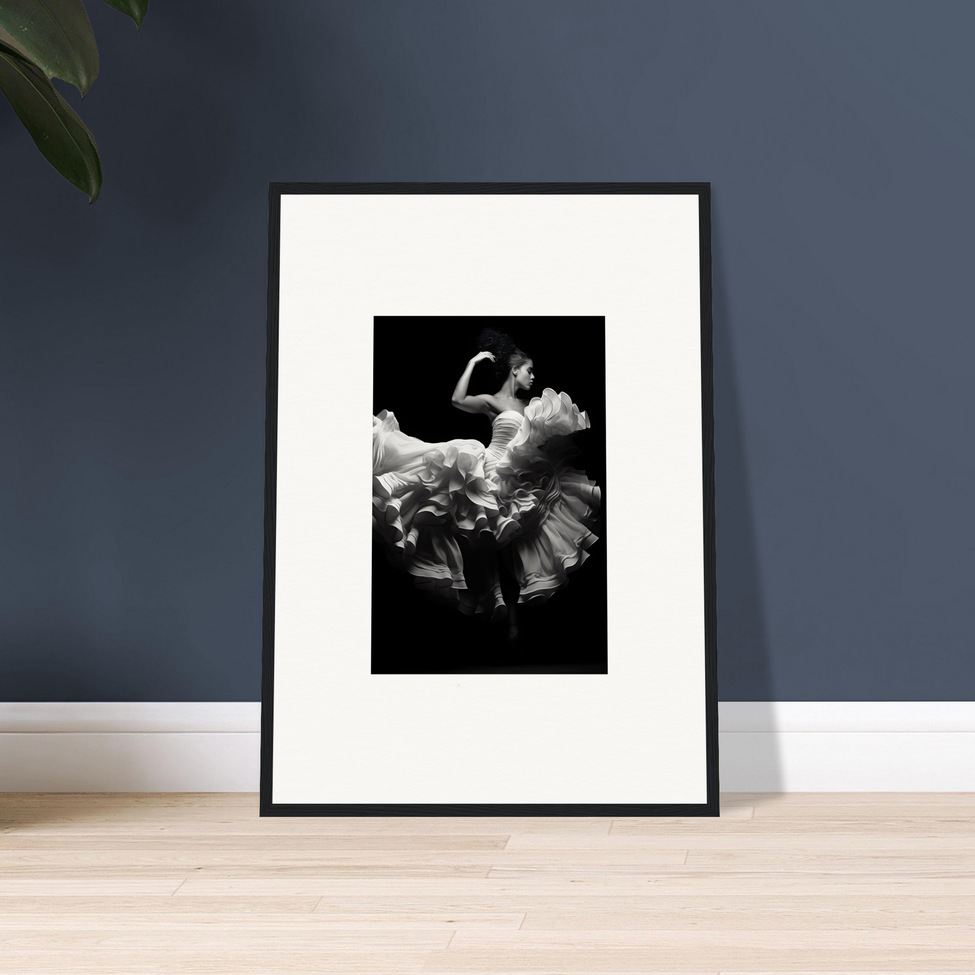 Framed black and white photograph of a dancer in a flowing dress mid-movement.