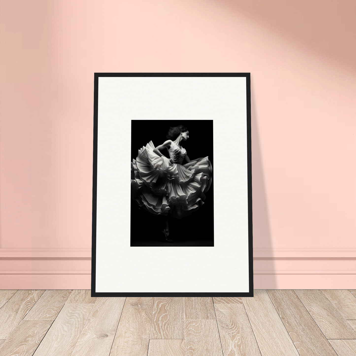 Framed black-and-white photograph of a dancer in flowing fabric.