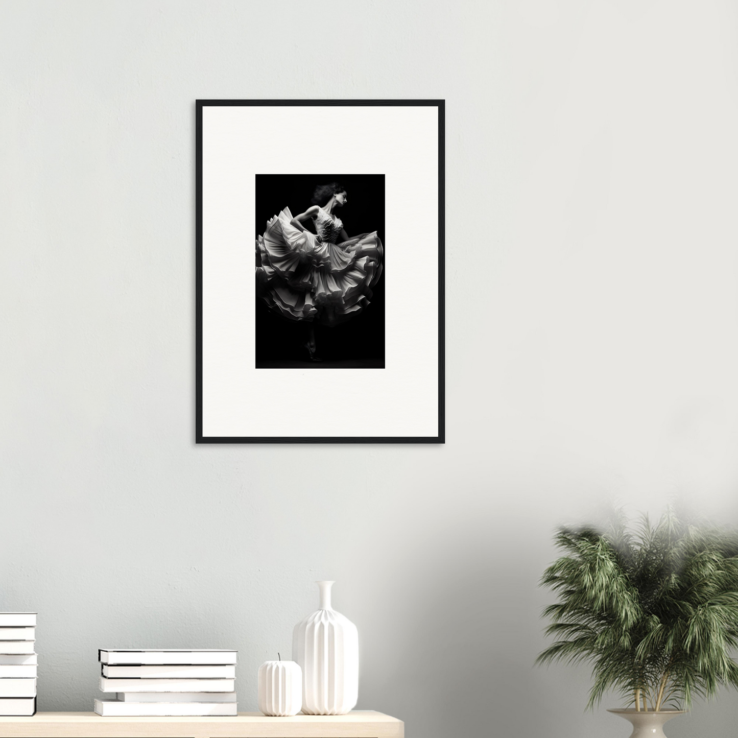 Framed black and white photograph of a dancer in a flowing dress.