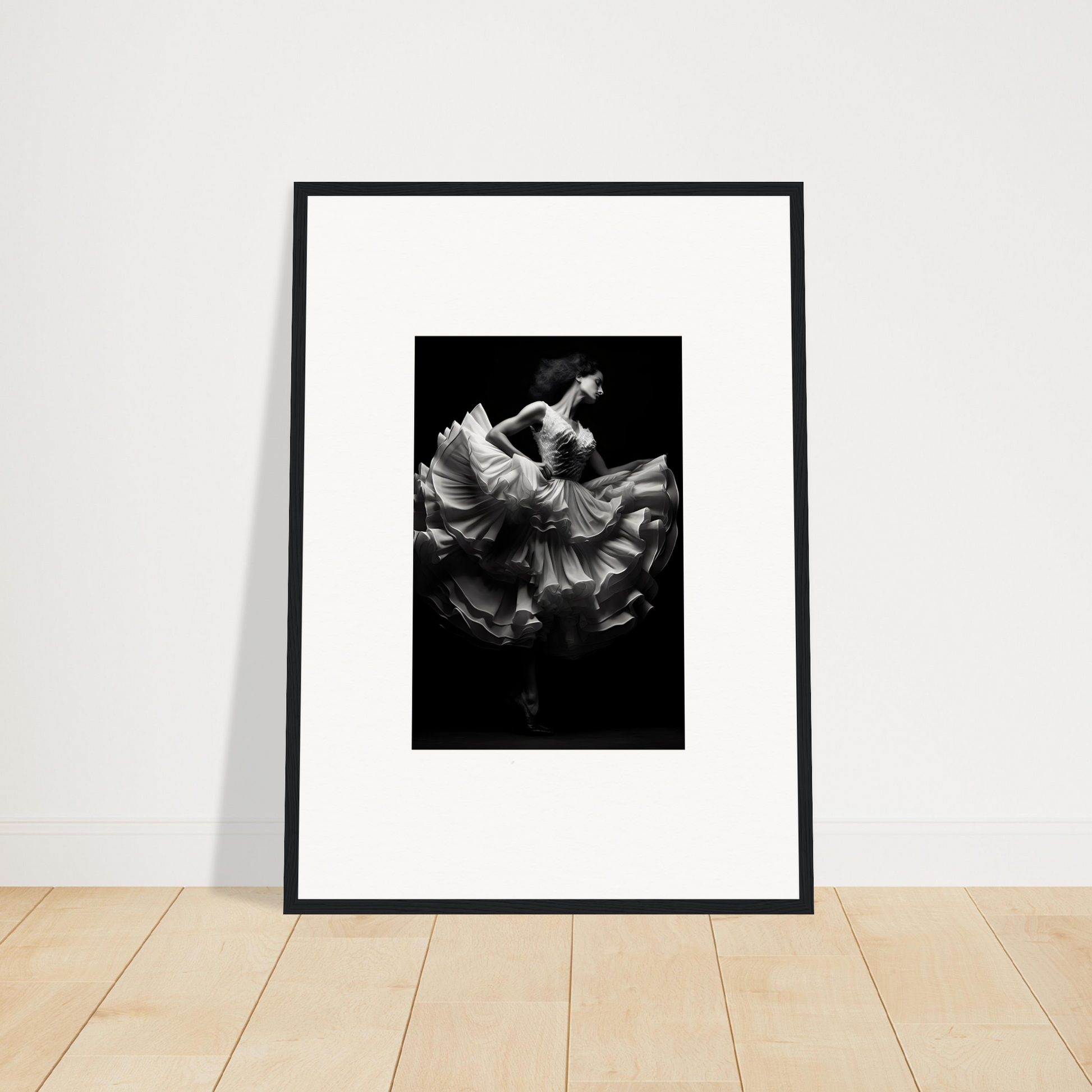 Framed black and white photograph of a dancer in flowing fabric.