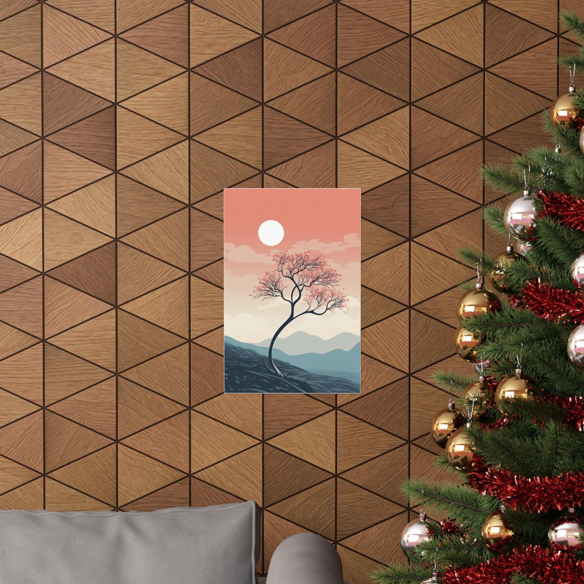 A christmas tree with a pink sky and mountains in the background