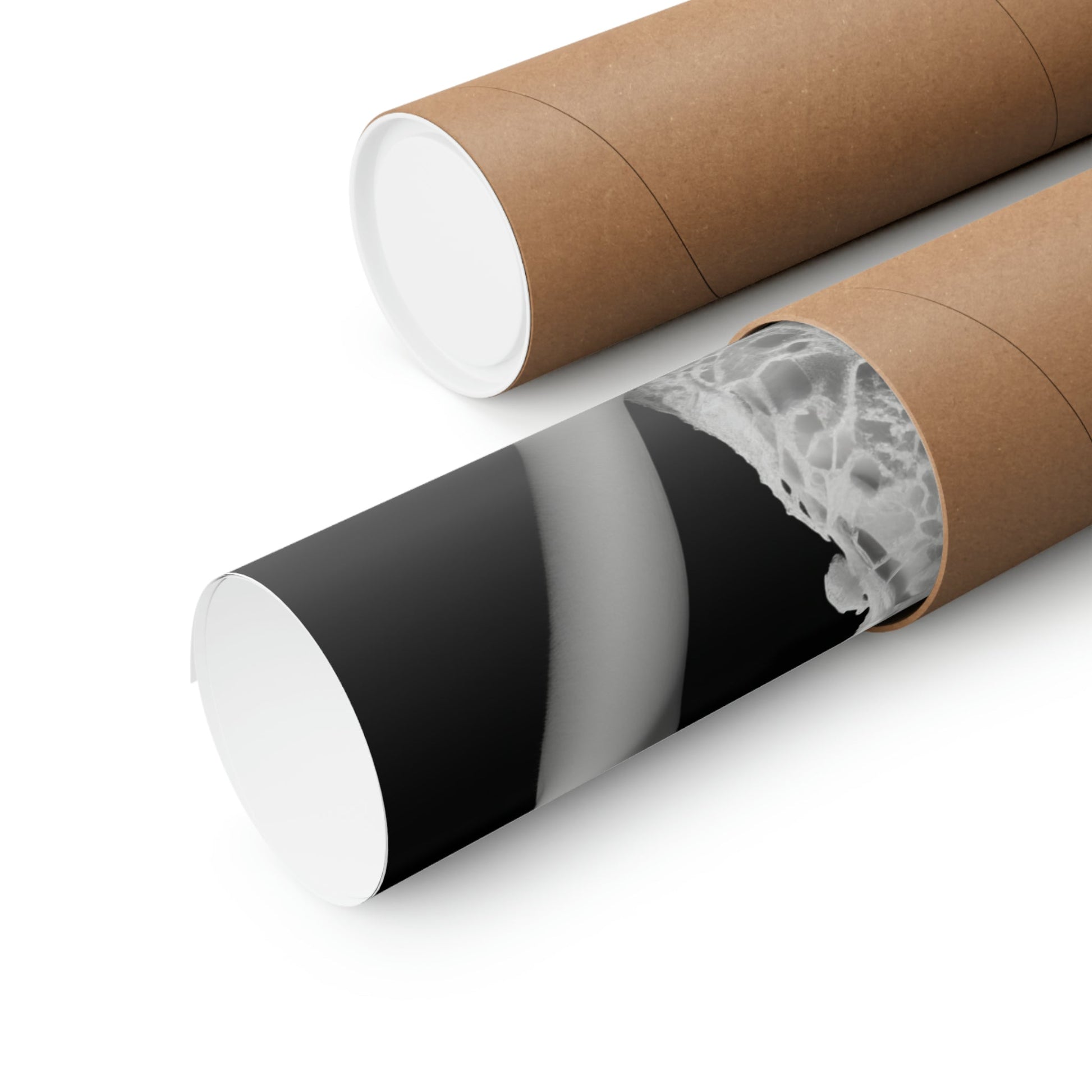 Two rolls of brown paper with a black and white design