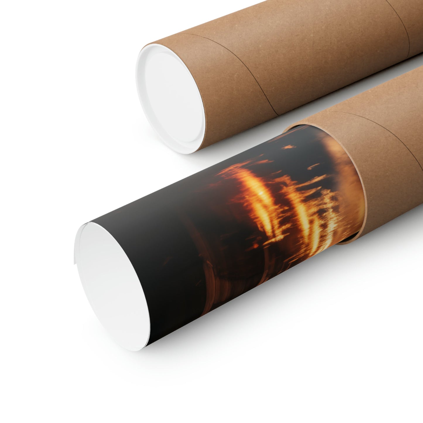 Cylindrical cardboard tubes, one displaying a fiery image on its surface.