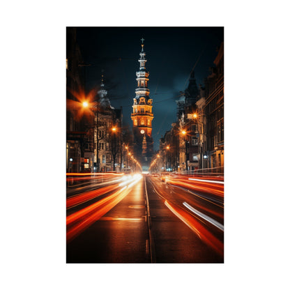 Illuminated tower with multiple tiers rising above a city street at night.