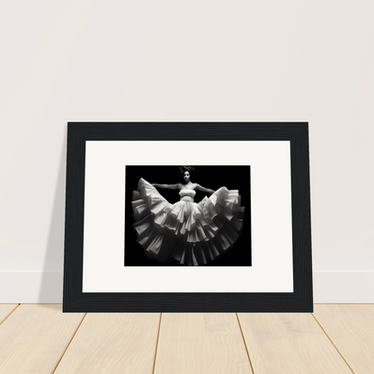 Framed black and white photograph of a dancer in a flowing dress with a dramatically flared skirt.